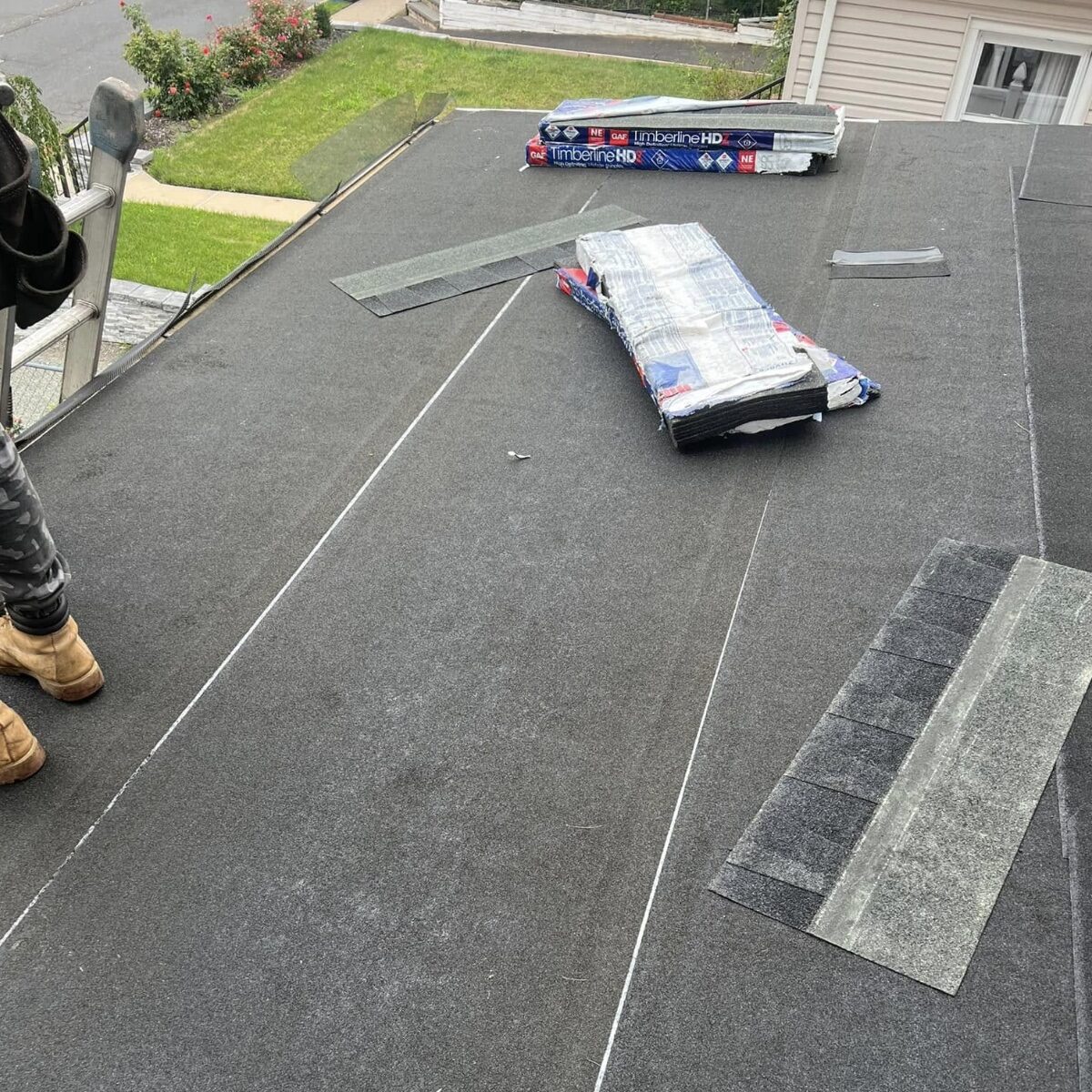 GAF Timberline HD shingle bundles staged on roof underlayment NJ