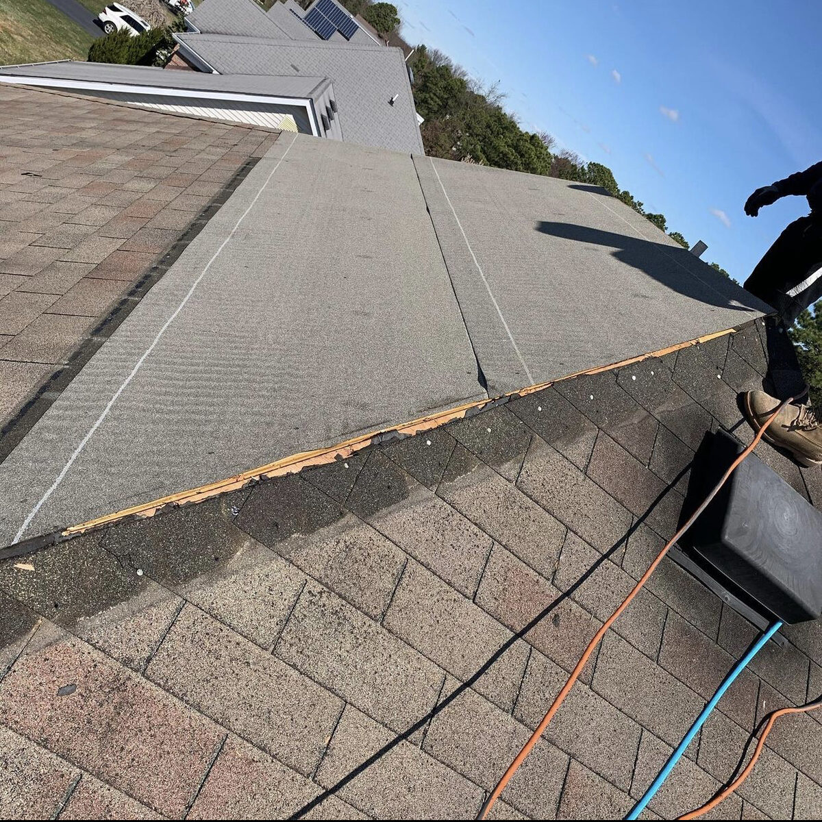 Roof shingles being stripped underlayment exposed repair NJ