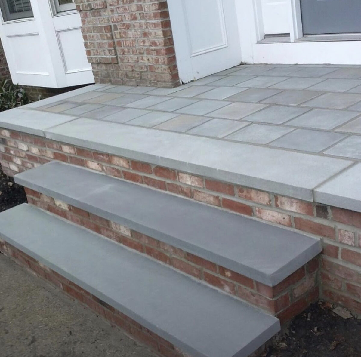 Finished bluestone front steps brick risers NJ