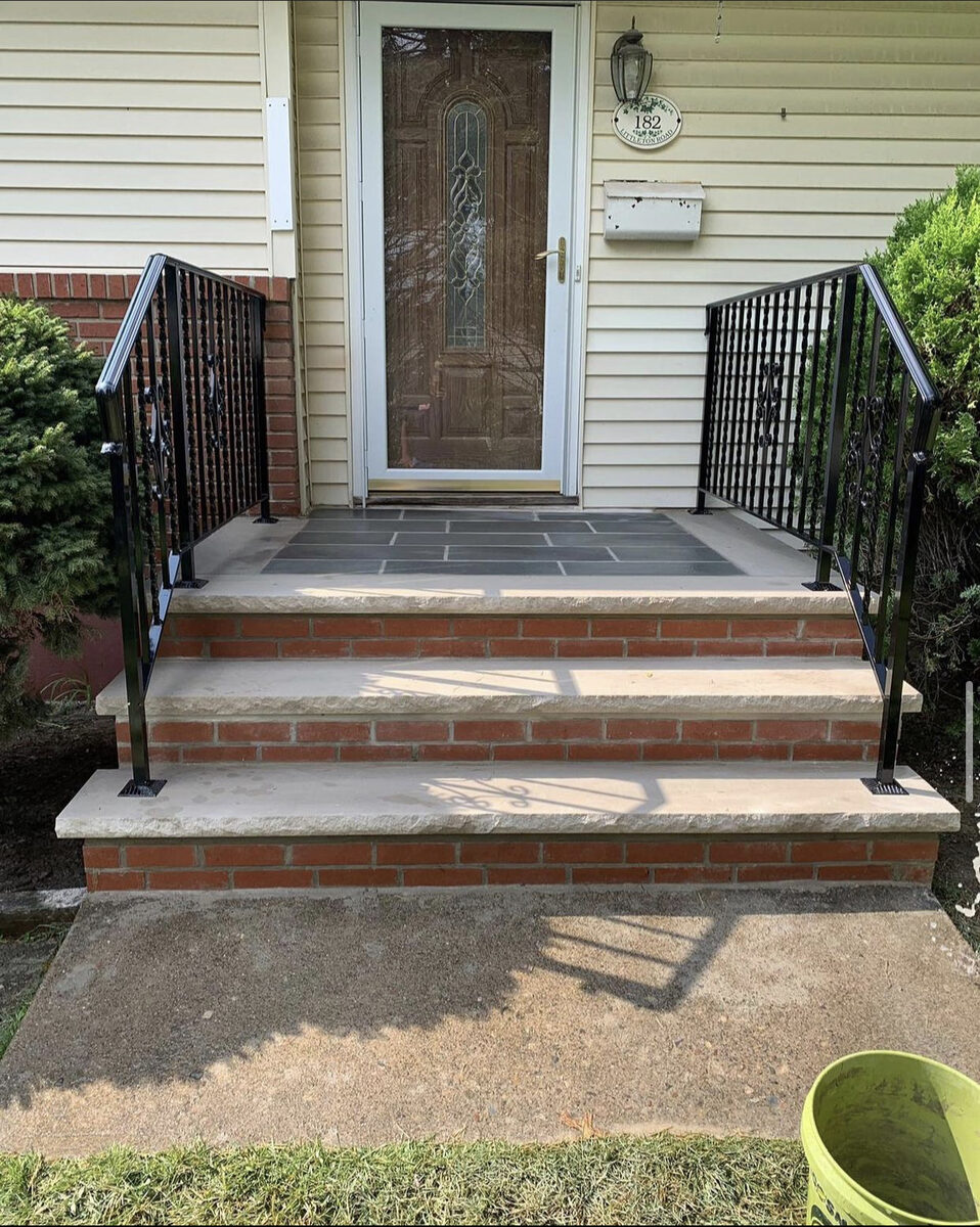 Finished front entry brick risers bluestone steps black iron railings NJ