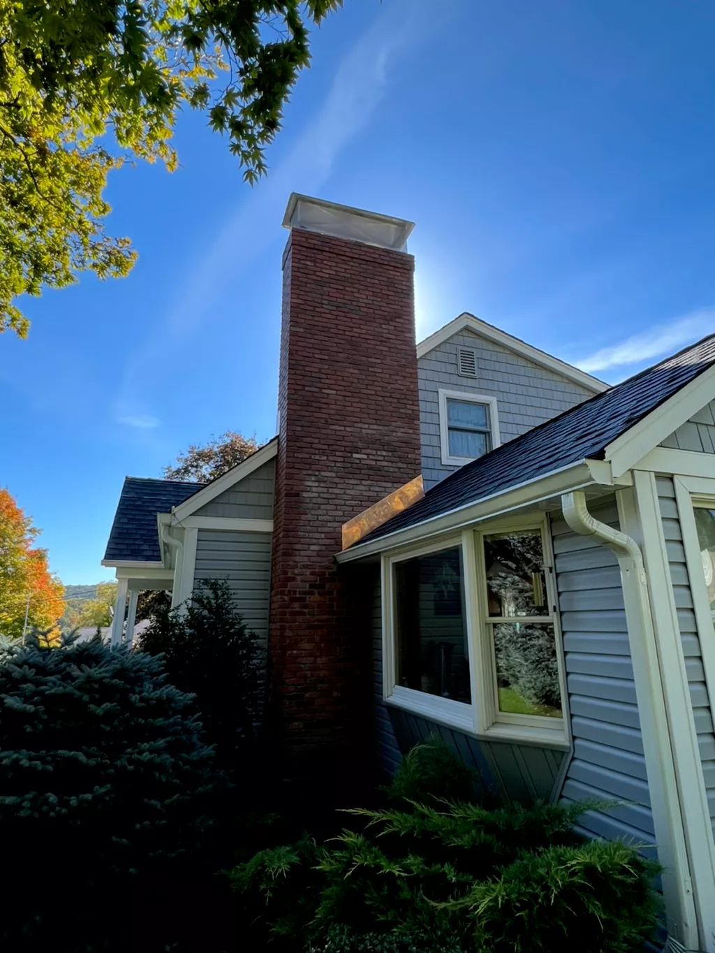 Rebuilt chimney new brick custom copper flashing custom cap NJ