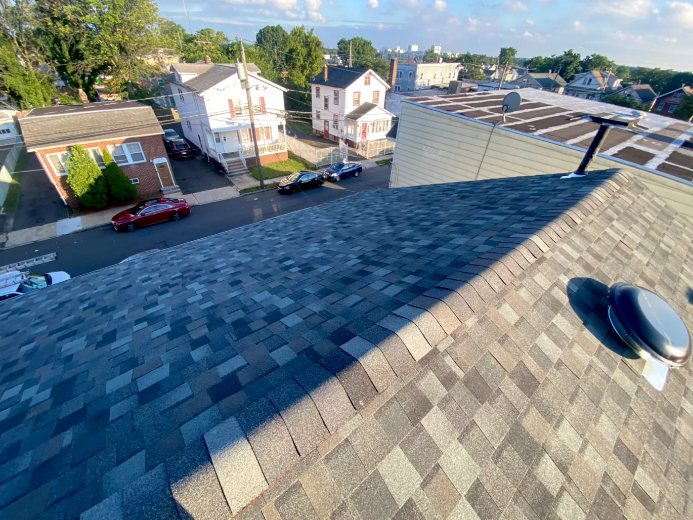 Completed dark gray shingle roof aerial view urban NJ