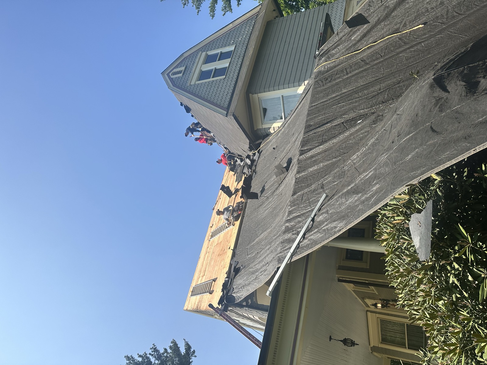 Roof deck exposed tarps protecting landscaping porch NJ