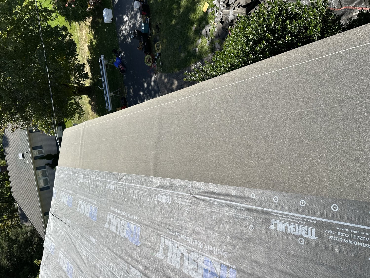 Clean synthetic underlayment edge over full roof deck NJ