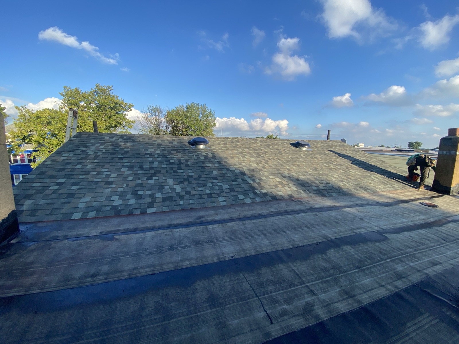 Completed architectural shingle roof flat section two vents NJ