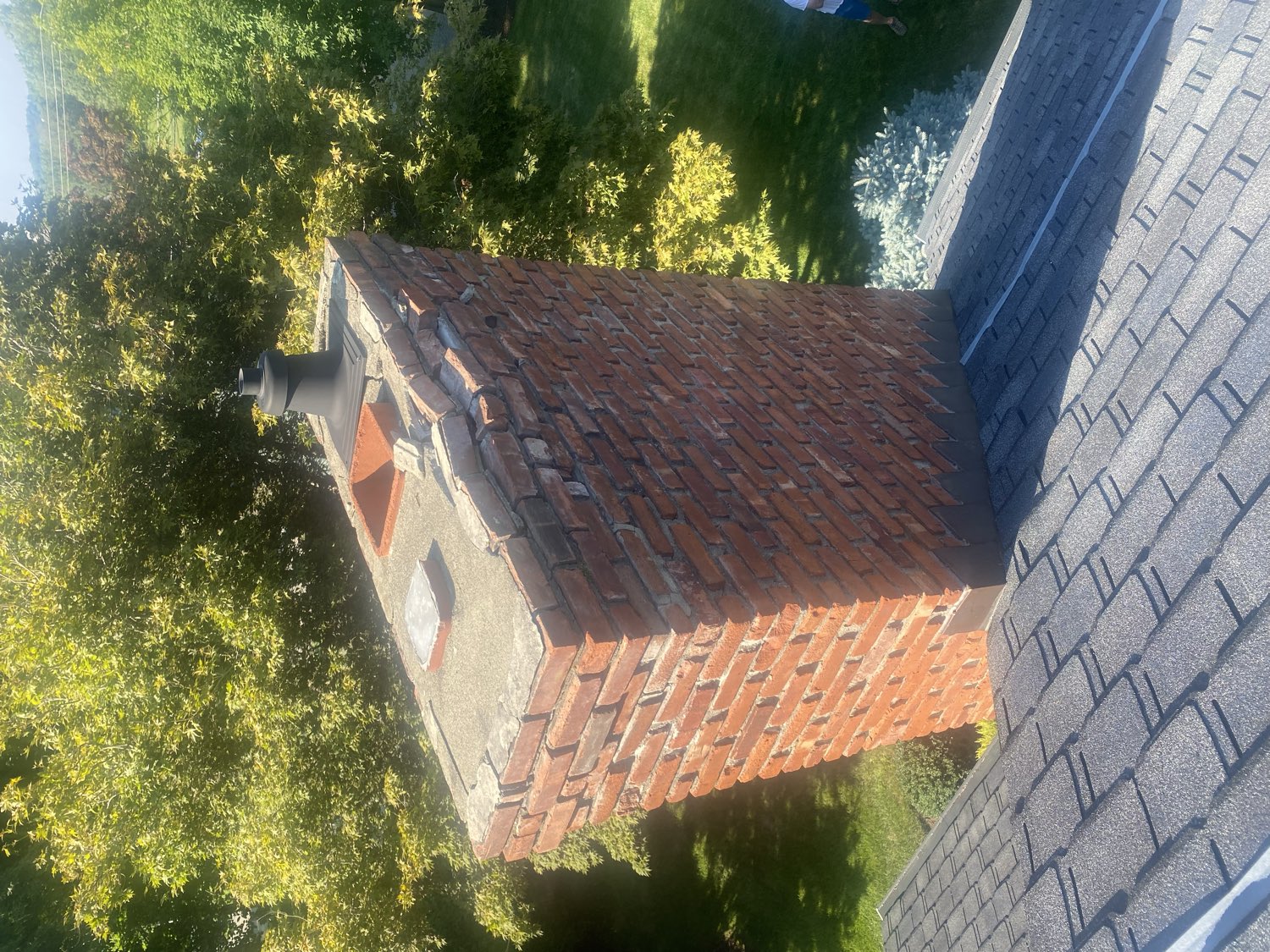 Deteriorated chimney crumbling brick failing mortar before rebuild NJ