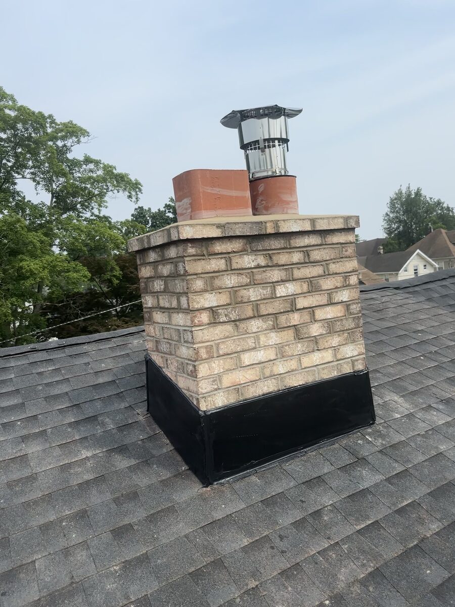 Completed chimney rebuild new flashing flue tiles stainless cap NJ
