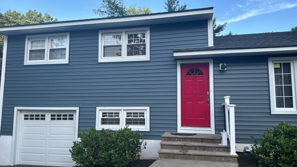Completed full roof replacement blue slate siding dark shingles NJ