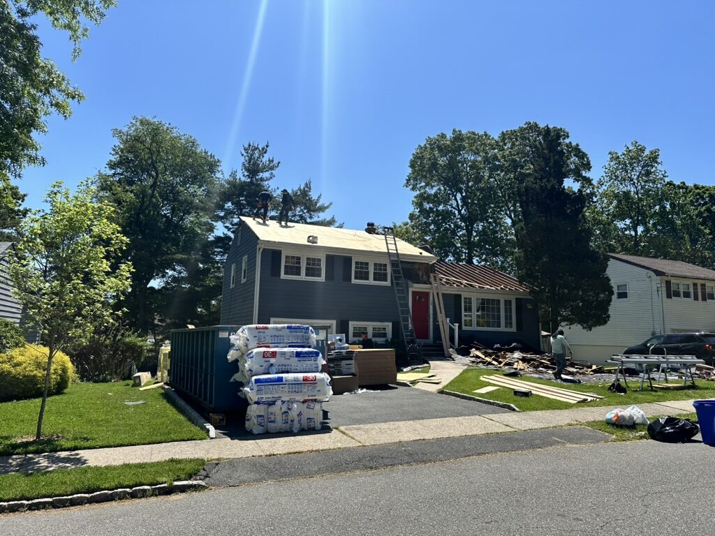 Roof tear off wide angle crew working blue home NJ